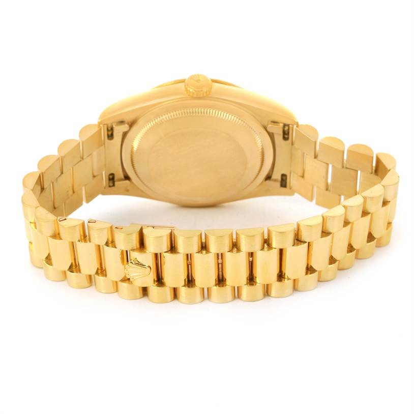 The image shows the back and bracelet of a Rolex President 18238 Men
s Yellow Gold Champagne Dial 18238 Men
s Yellow Gold Champagne Dial model watch from a rear angle.
