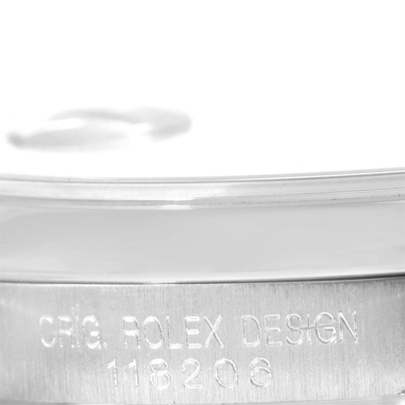 The image shows a close-up view of the serial engraving on the case side of a Rolex President 118206 Men's Platinum Silver Dial 118206 Men's Platinum Silver Dial model watch.