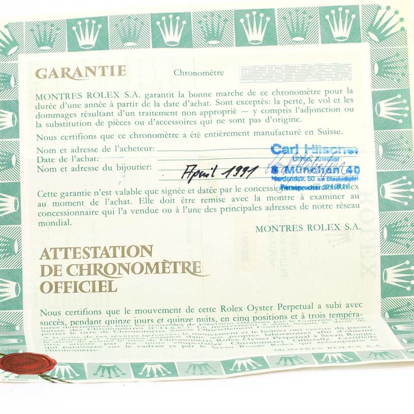 The image shows a certification and warranty document for a Rolex President 18238 Men
s Yellow Gold Champagne Dial 18238 Men
s Yellow Gold Champagne Dial model watch, dated April 1991, with green borders and text.