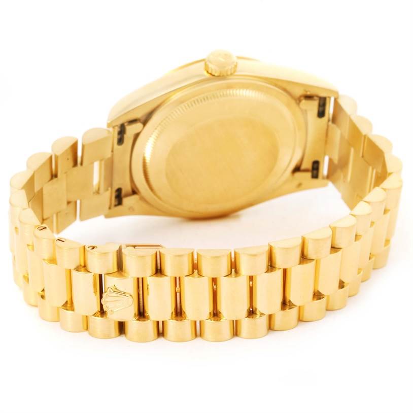 This image shows the back case and bracelet of a Rolex President 18238 Men
s Yellow Gold Champagne Dial 18238 Men
s Yellow Gold Champagne Dial model watch from an angled view.