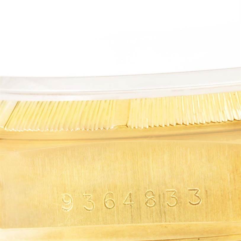 This image shows the side view of the case and the serial number of a Rolex President 18078 Men's Yellow Gold Brown Dial 18078 Men's Yellow Gold Brown Dial model watch.