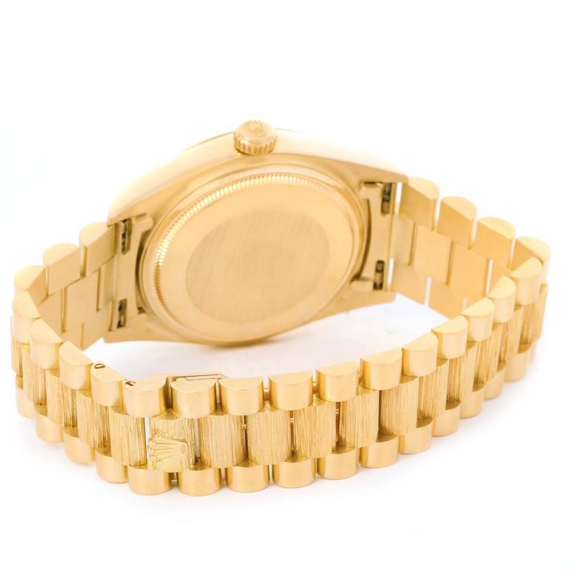 The image shows the back and bracelet of a Rolex President 18078 Men's Yellow Gold Brown Dial 18078 Men's Yellow Gold Brown Dial model watch from an angled rear view.