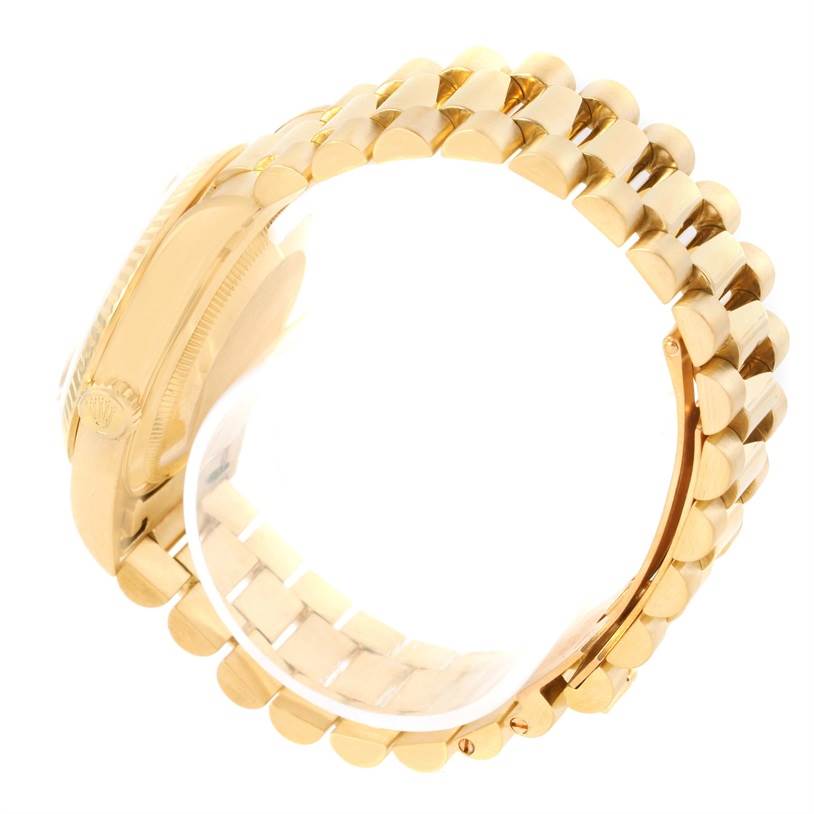 This image shows a side view of the golden bracelet and case of a Rolex President 18238 Men's Yellow Gold Black Dial 18238 Men's Yellow Gold Black Dial model watch.