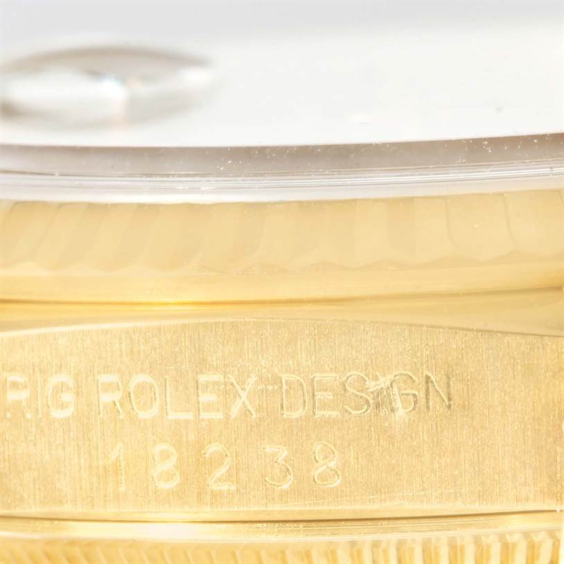 This close-up image shows the side view of a Rolex President 18238 Men's Yellow Gold Black Dial 18238 Men's Yellow Gold Black Dial model watch with the engraved model number 18238.