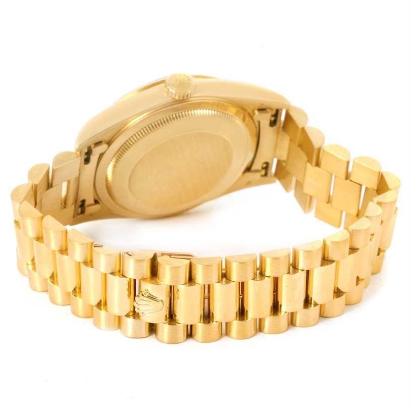 The image shows the back of the Rolex President 18238 Men's Yellow Gold Black Dial 18238 Men's Yellow Gold Black Dial watch, highlighting the case back and the President bracelet.