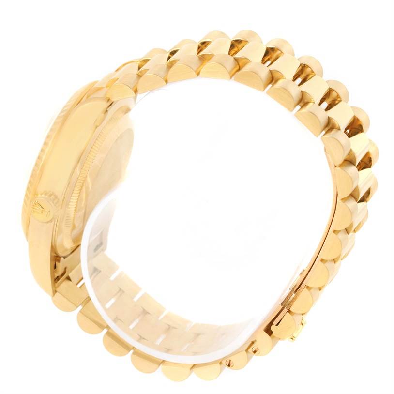 The image shows a side view of the Rolex President 18238 Men
s Yellow Gold Champagne Dial 18238 Men
s Yellow Gold Champagne Dial model
s gold case and band.