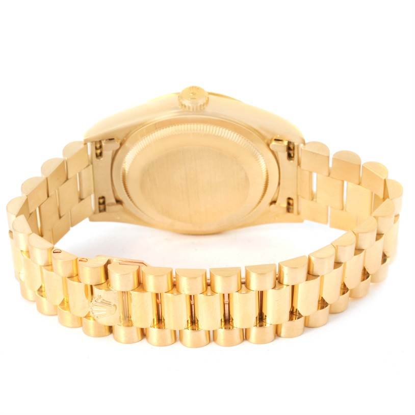 The image shows the back and bracelet of a Rolex President 18238 Men
s Yellow Gold Champagne Dial 18238 Men
s Yellow Gold Champagne Dial model watch, highlighting the gold case and band.