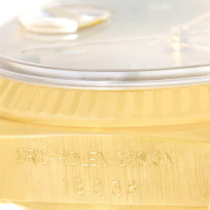 The image shows a close-up of the side of a Rolex President 18038 Men
s Yellow Gold Champagne Dial 18038 Men
s Yellow Gold Champagne Dial watch, highlighting the gold case and engraved model number "18038".