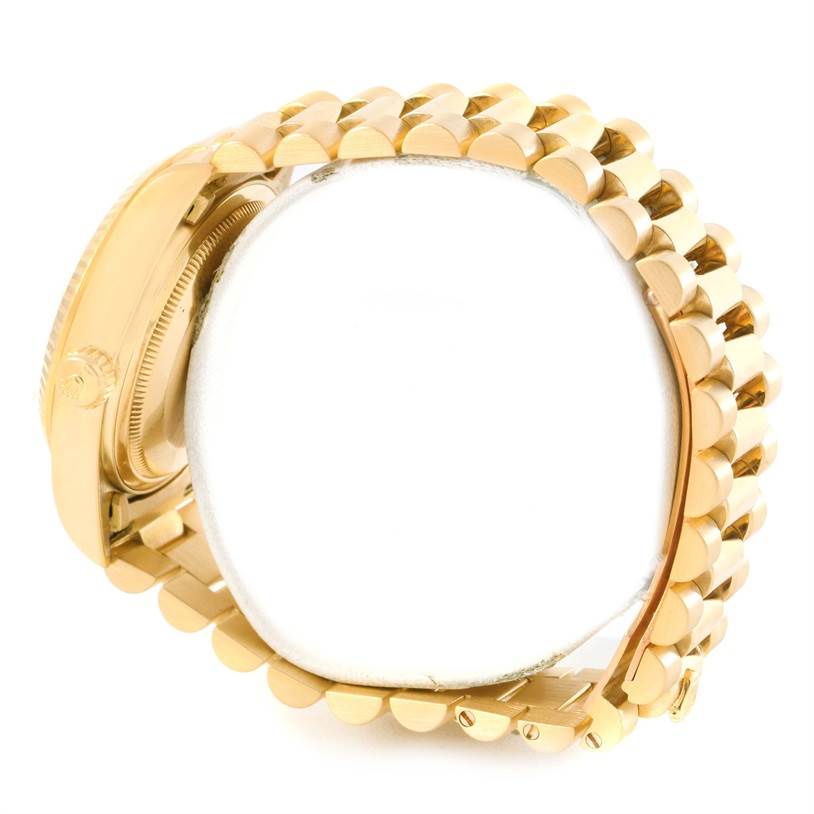 The image shows the side view of a Rolex President 18038 Men
s Yellow Gold Champagne Dial 18038 Men
s Yellow Gold Champagne Dial model watch, highlighting the gold band and part of the case and crown.