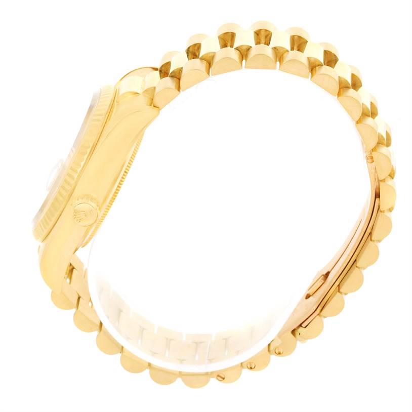 The image shows a side view of a Rolex President 18038 Men
s Yellow Gold Champagne Dial 18038 Men
s Yellow Gold Champagne Dial model watch, highlighting its gold case, crown, and bracelet.