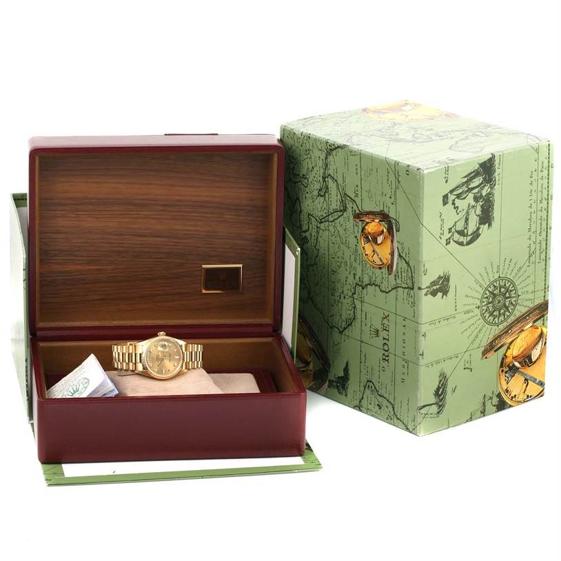 The image shows a Rolex President 18038 Men
s Yellow Gold Champagne Dial 18038 Men
s Yellow Gold Champagne Dial model watch inside an open wooden box, with the box cover placed alongside.