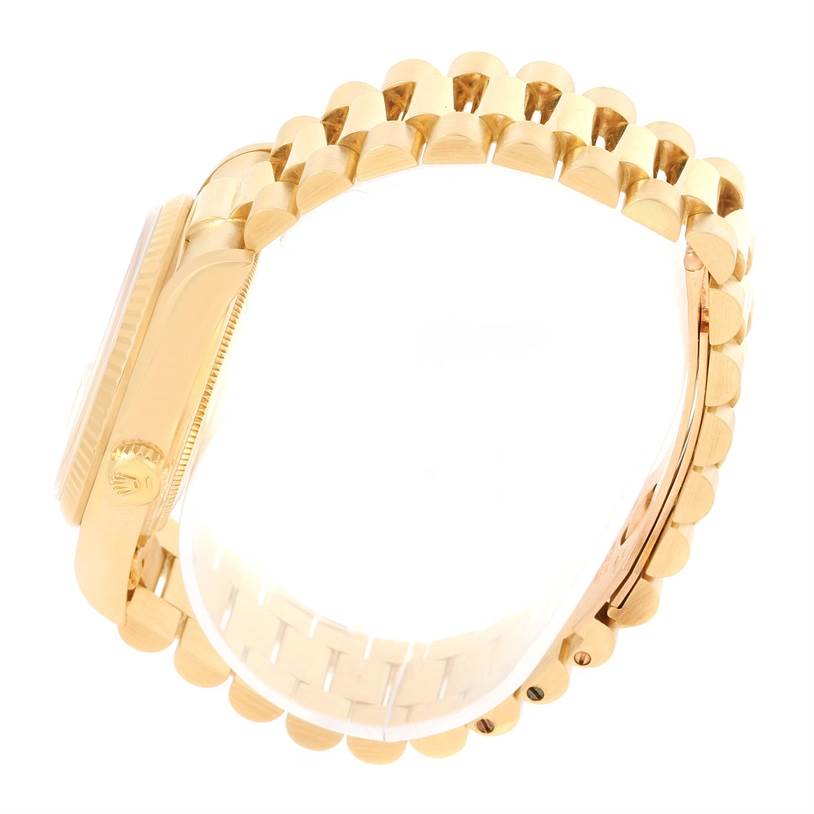 This side view showcases the President model by Rolex, emphasizing its band and crown.