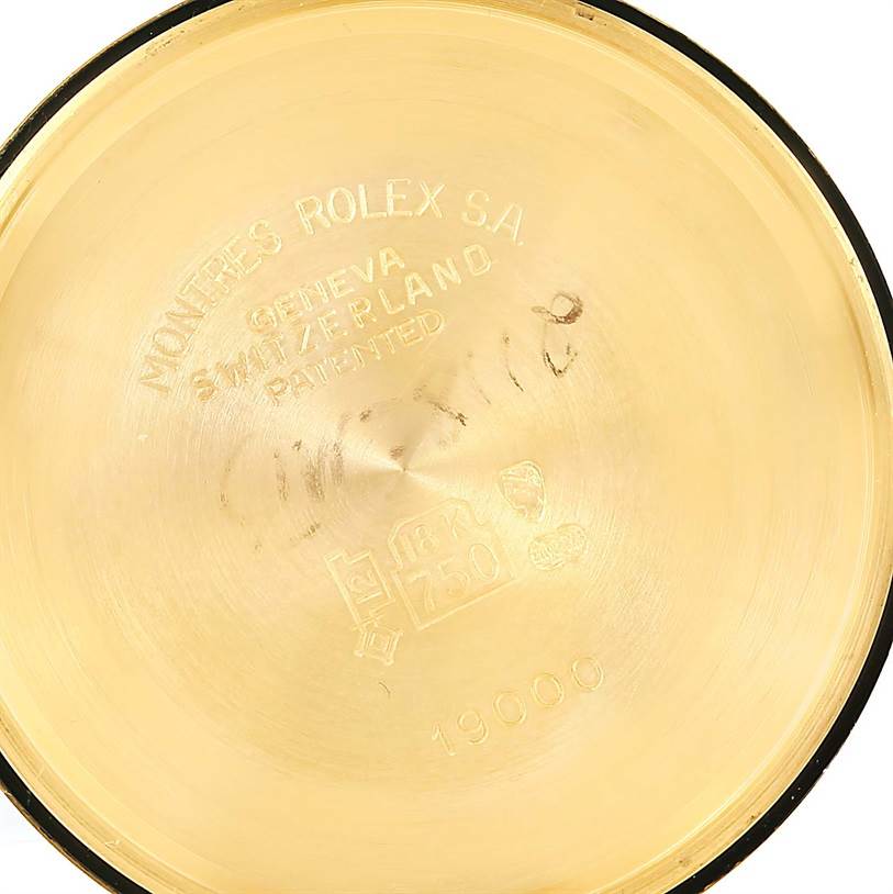 This image shows the interior of the case back of a Rolex President 19018 Men's Yellow Gold Brown Dial 19018 Men's Yellow Gold Brown Dial watch model, displaying engravings and hallmarks.