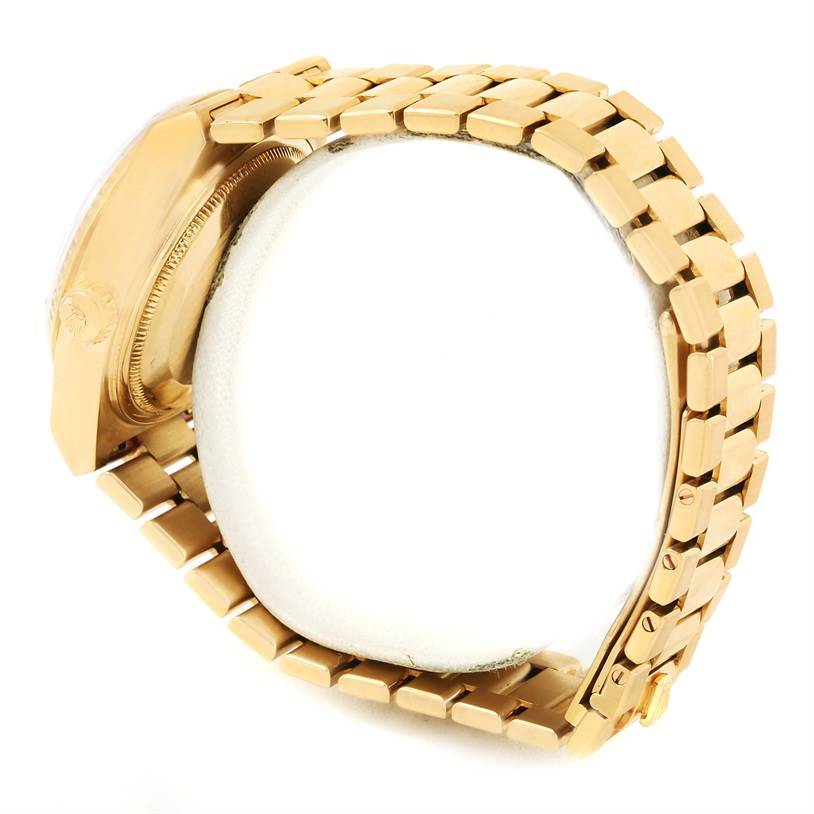 The image shows a side view of a Rolex President 19018 Men's Yellow Gold Brown Dial 19018 Men's Yellow Gold Brown Dial model, focusing on the gold bracelet and partially visible watch case.