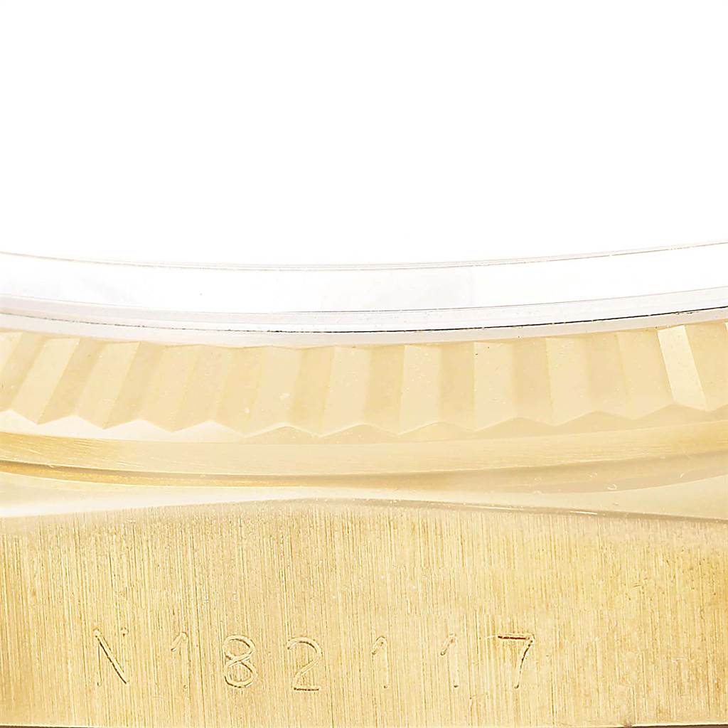 This image shows a close-up view of the gold case edge and fluted bezel of a Rolex President 18238 Men
s Yellow Gold Beige Dial 18238 Men
s Yellow Gold Beige Dial model watch.