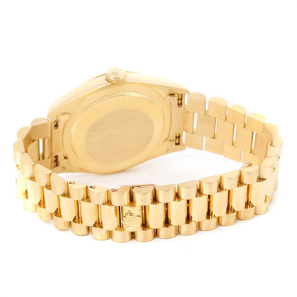 The image shows the back case and bracelet of a Rolex President 18238 Men
s Yellow Gold Beige Dial 18238 Men
s Yellow Gold Beige Dial model watch at an angled rear view.