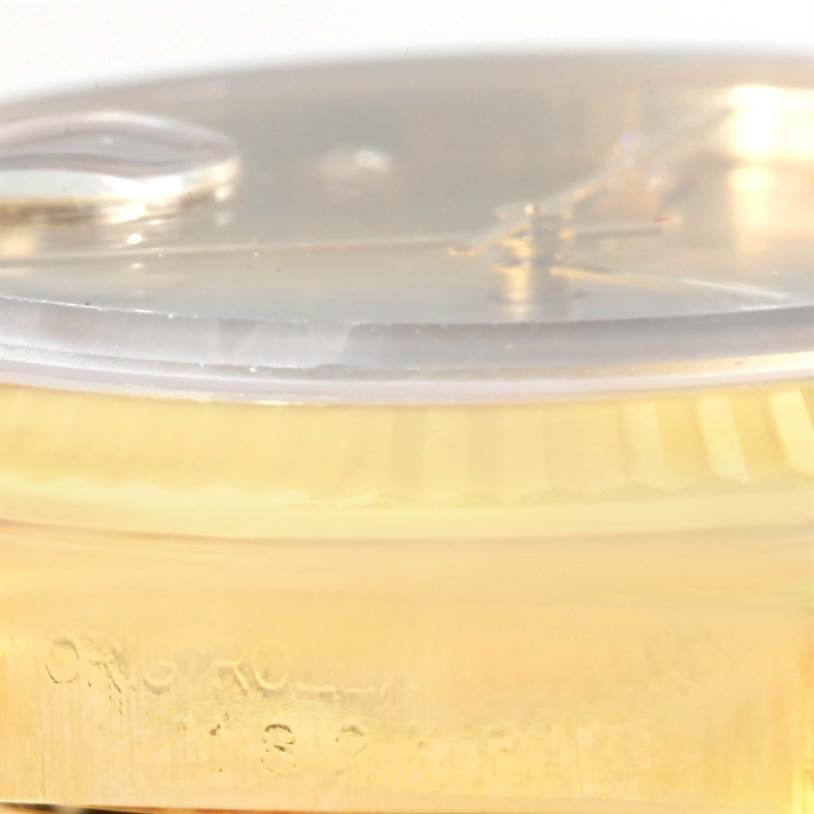 This image shows a close-up side view of the bezel and crystal of a Rolex President 18238 Men
s Yellow Gold Champagne Dial 18238 Men
s Yellow Gold Champagne Dial model watch.