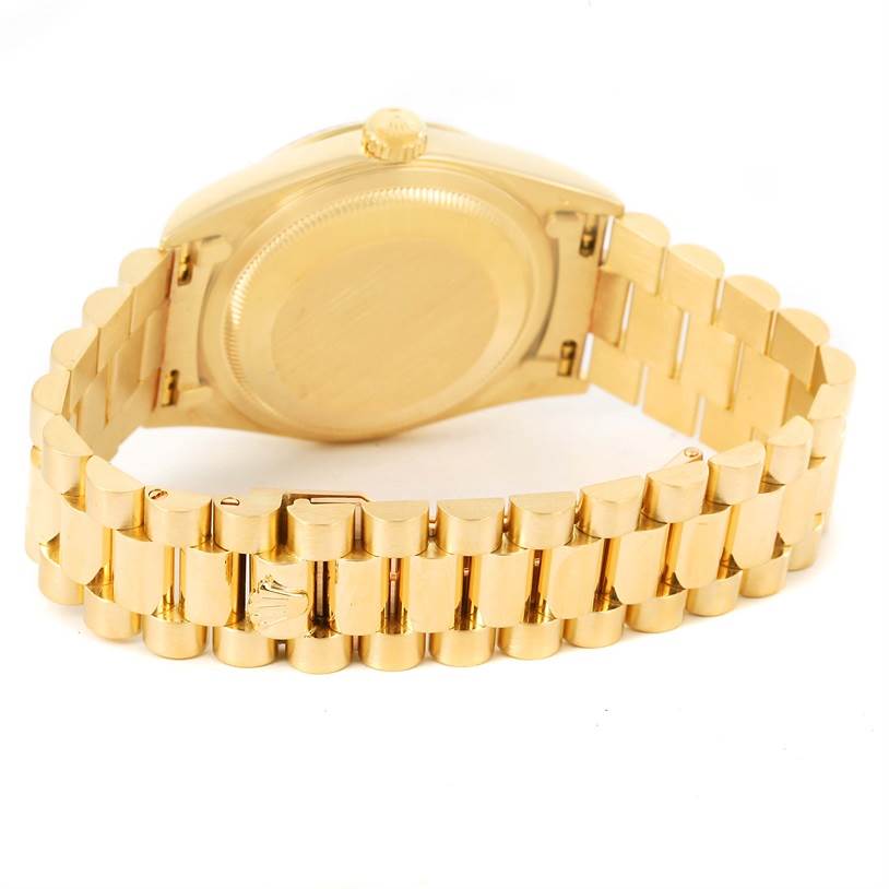 The image shows the back case and bracelet of a Rolex President 18238 Men
s Yellow Gold Champagne Dial 18238 Men
s Yellow Gold Champagne Dial model watch at an angled view.