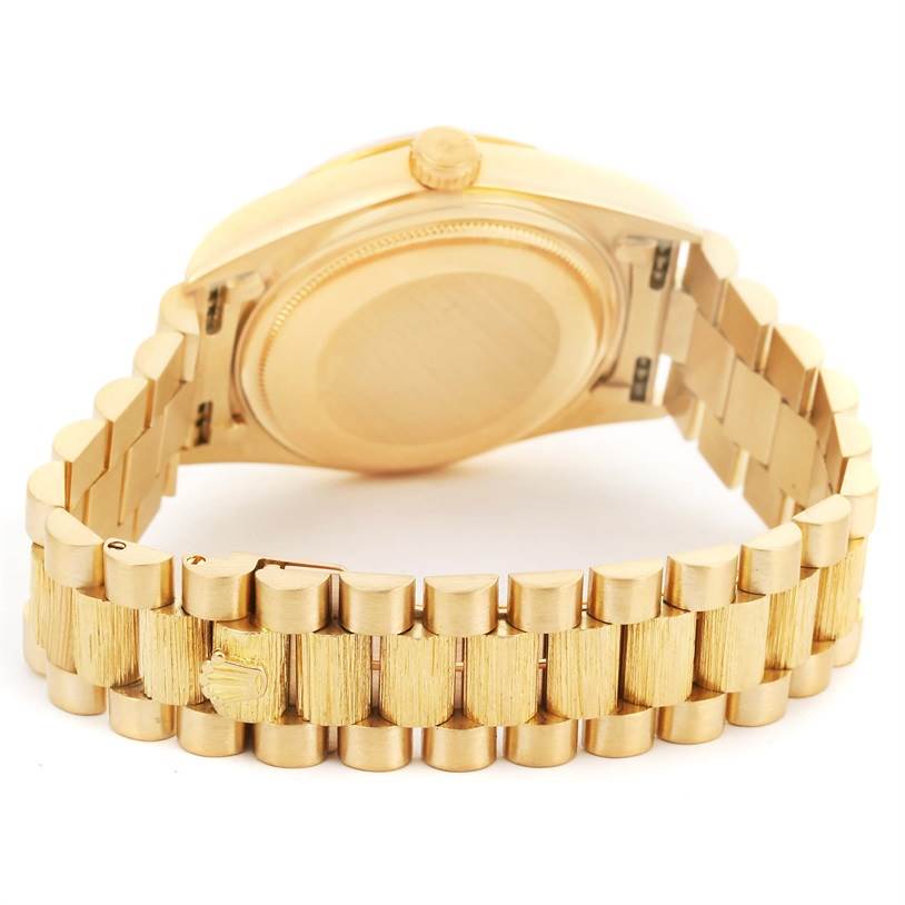 The photo shows the back and bracelet of a Rolex President 18078 Men
s Yellow Gold Champagne Dial 18078 Men
s Yellow Gold Champagne Dial model watch from a slightly angled rear view.