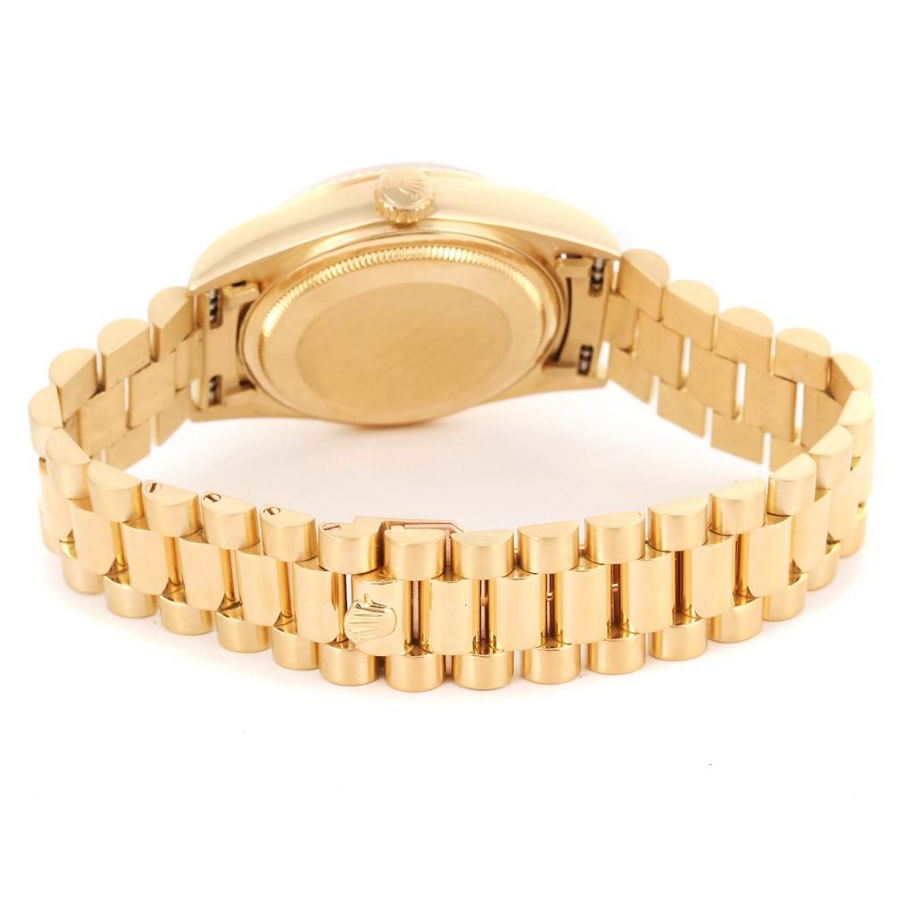 This image shows the back and bracelet of a gold Rolex President 18038 Men
s Yellow Gold Black Dial 18038 Men
s Yellow Gold Black Dial model watch, focusing on the case back and clasp.