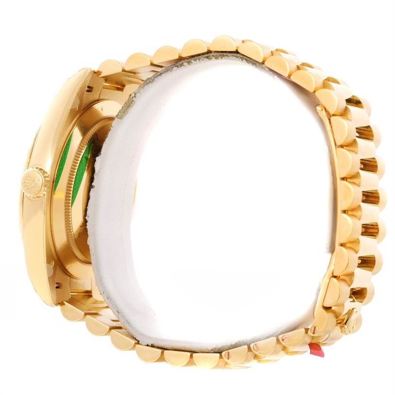 This image shows a side view of the Rolex President 228238 Men's Yellow Gold Champagne Dial 228238 Men's Yellow Gold Champagne Dial model watch, highlighting its gold case and bracelet.