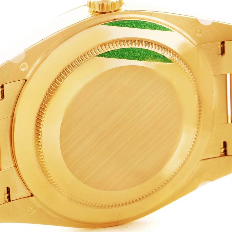 This image shows the back case and part of the bracelet of a Rolex President 228238 Men's Yellow Gold Champagne Dial 228238 Men's Yellow Gold Champagne Dial model watch.