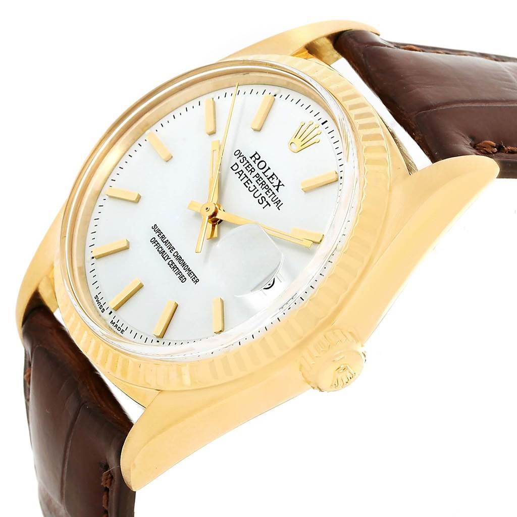 The image shows a side angle of the Rolex President 1601 Men
s Yellow Gold White Dial 1601 Men
s Yellow Gold White Dial model, highlighting its dial, bezel, crown, and brown leather strap.