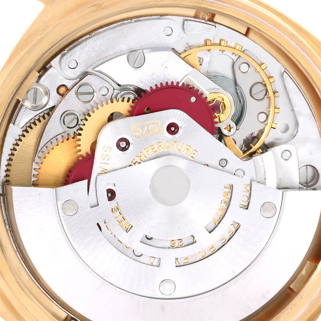 The image shows the internal mechanism of the Rolex President 1601 Men
s Yellow Gold White Dial 1601 Men
s Yellow Gold White Dial model watch, highlighting gears and components.
