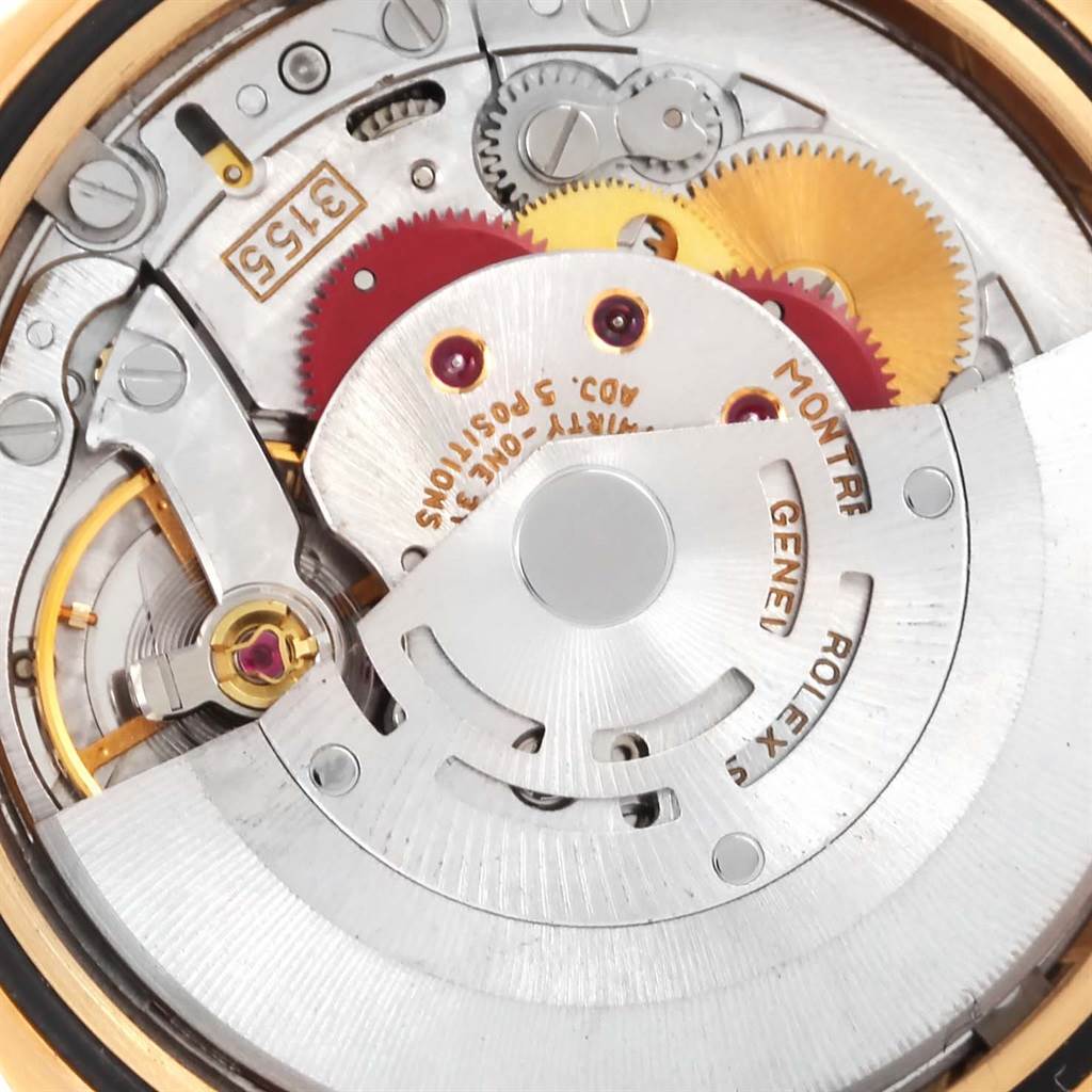 This is a close-up of the movement mechanism of a Rolex President 18238 Men
s Yellow Gold Champagne Dial 18238 Men
s Yellow Gold Champagne Dial model watch, showing gears and the rotor.