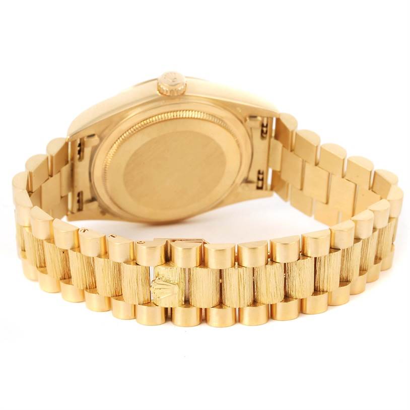 This image shows the back of a Rolex President 18078 Men
s Yellow Gold Champagne Dial 18078 Men
s Yellow Gold Champagne Dial model watch, highlighting its gold bracelet and clasp.