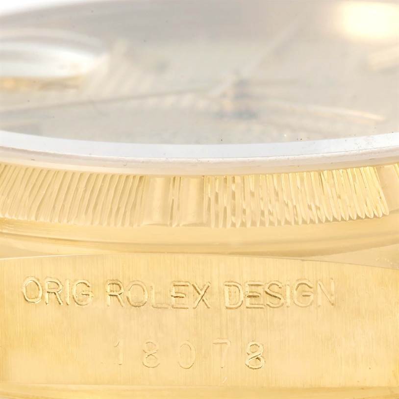 The image shows a close-up of the side of the bezel and the engraved text on the case of the Rolex President 18078 Men
s Yellow Gold Champagne Dial 18078 Men
s Yellow Gold Champagne Dial model.