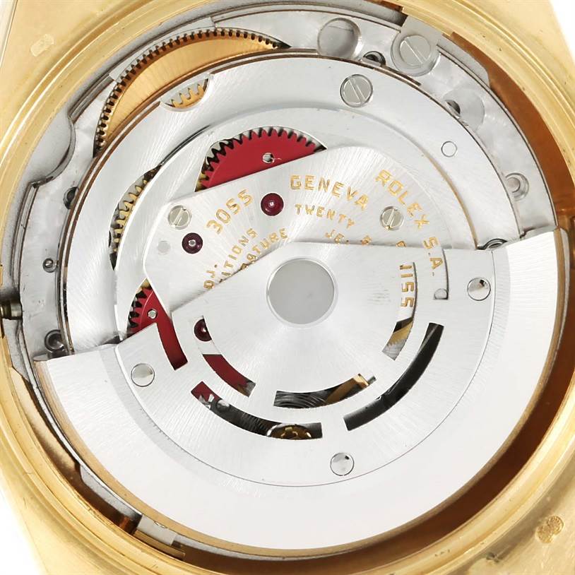 This image shows a close-up of the Rolex President 18078 Men
s Yellow Gold Champagne Dial 18078 Men
s Yellow Gold Champagne Dial model watch
s internal mechanism, including gears and the rotor.