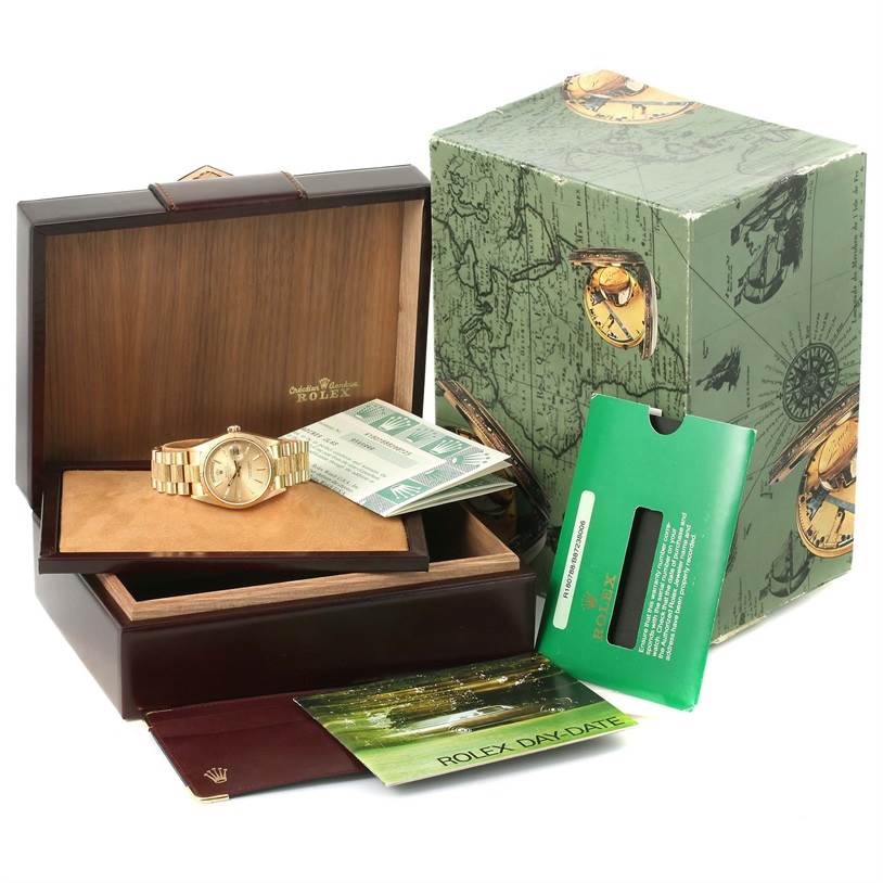 The image shows a Rolex President 18078 Men
s Yellow Gold Champagne Dial 18078 Men
s Yellow Gold Champagne Dial model watch in its open box, along with its packaging, warranty card, and manuals.