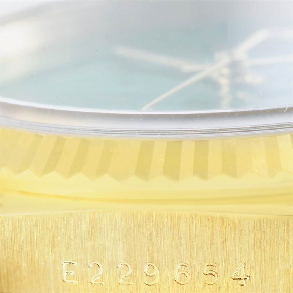 The image shows a close-up angle of a Rolex President 16238 Men's Yellow Gold Green Dial 16238 Men's Yellow Gold Green Dial model, highlighting the engraved serial number on its gold case.