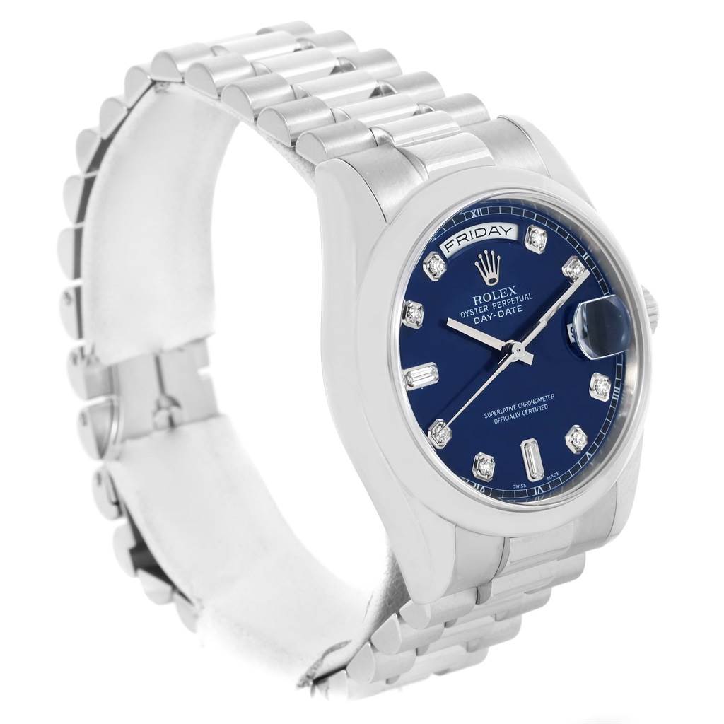 The image shows a side angle of a Rolex President 118206 Men's Platinum Silver Dial 118206 Men's Platinum Silver Dial model watch, highlighting its band, bezel, crown, and blue dial.