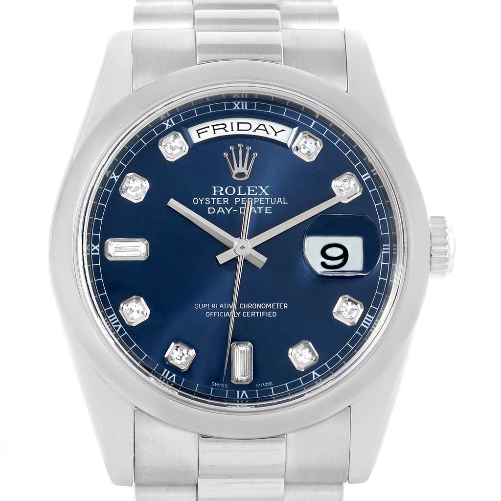 This image shows the face and partial bracelet of a Rolex President 118206 Men's Platinum Silver Dial 118206 Men's Platinum Silver Dial Day-Date watch featuring a blue dial and diamond hour markers.