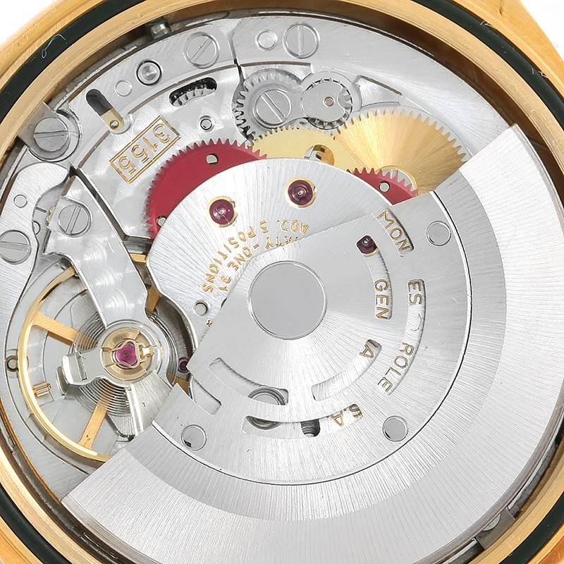 This image shows the intricate inner mechanisms of a Rolex President 18238 Men
s Yellow Gold Champagne Dial 18238 Men
s Yellow Gold Champagne Dial model watch from a close-up, top-down angle.