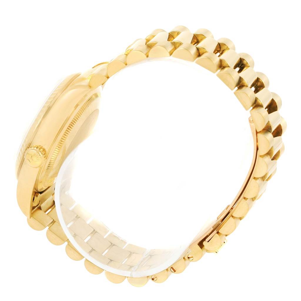 The image shows a side view of the Rolex President 18238 Men
s Yellow Gold Champagne Dial 18238 Men
s Yellow Gold Champagne Dial model, highlighting its gold case and bracelet.