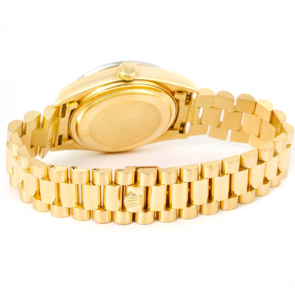 The image shows the back view of a Rolex President 18048 Men
s Yellow Gold Champagne Dial 18048 Men
s Yellow Gold Champagne Dial model watch, highlighting its gold case and bracelet.