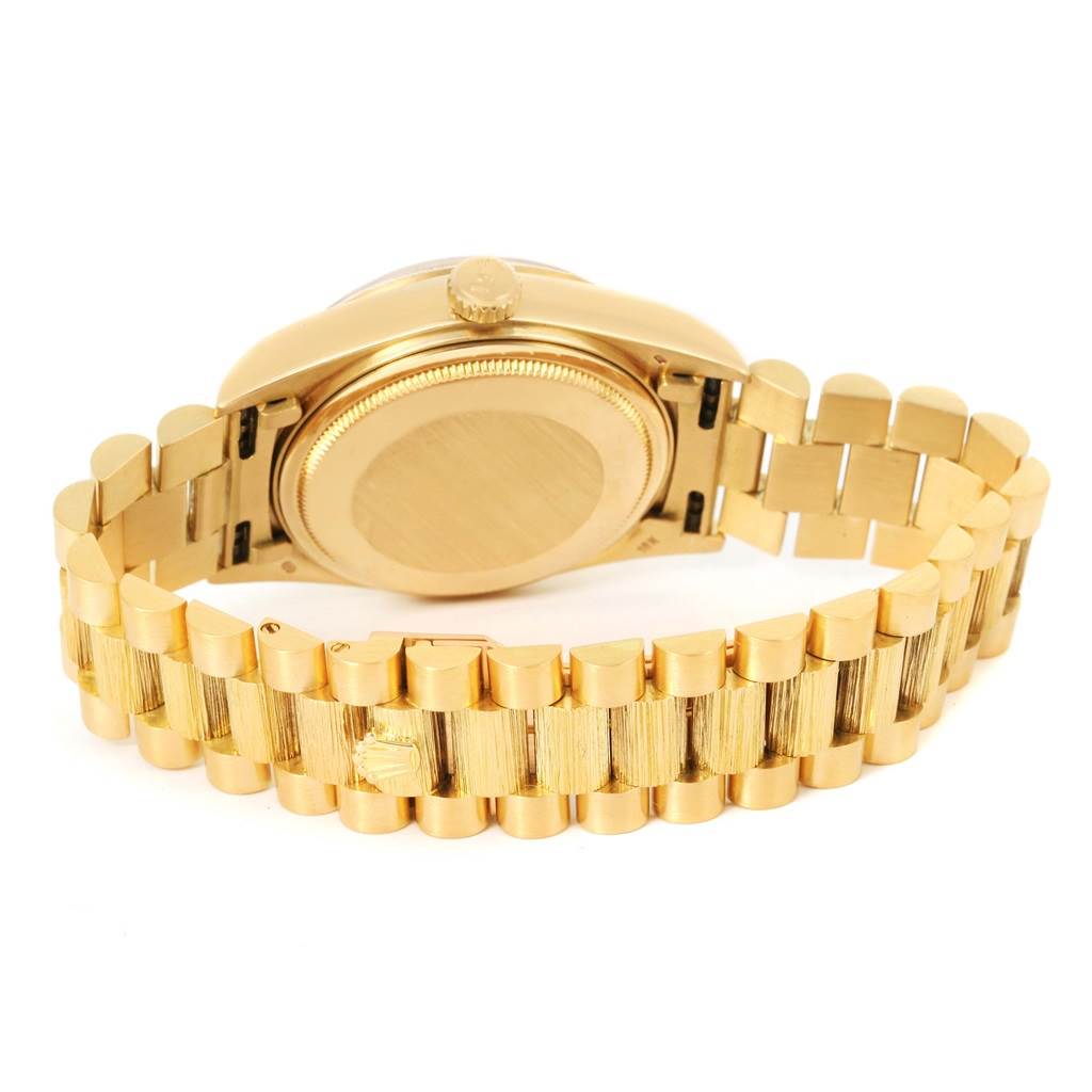 The image shows the case back and bracelet of a Rolex President 18078 Men
s Yellow Gold Champagne Dial 18078 Men
s Yellow Gold Champagne Dial model watch from a rear angle.