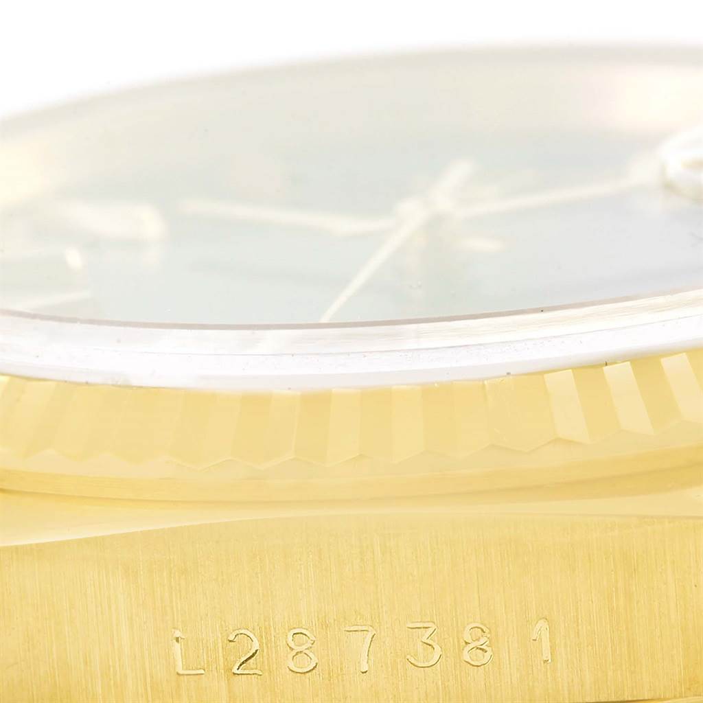 The image shows a close-up of the serial number, bezel, and partial face of a Rolex President 18238 Men's Yellow Gold Blue Dial 18238 Men's Yellow Gold Blue Dial model watch.