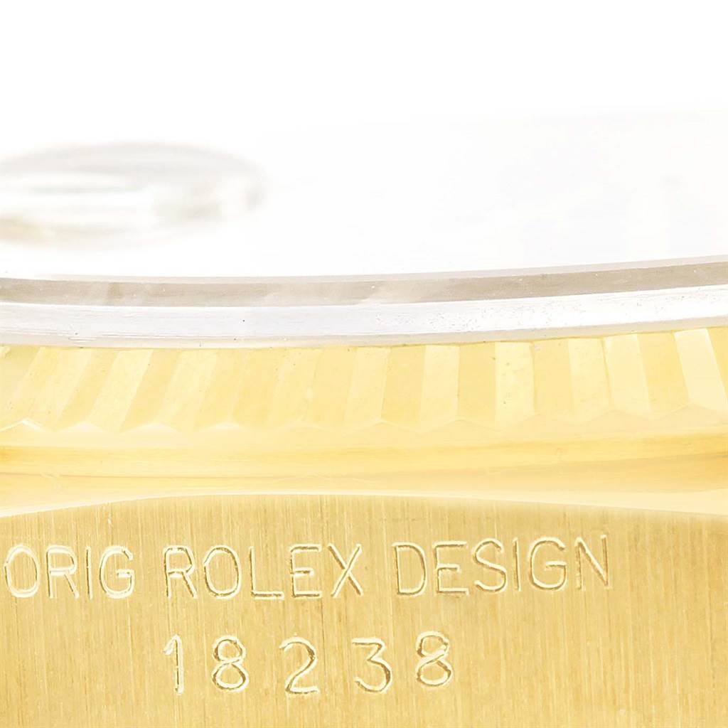 This image shows the side view of a Rolex President 18238 Men's Yellow Gold Blue Dial 18238 Men's Yellow Gold Blue Dial model watch, highlighting the case with "ORIG ROLEX DESIGN 18238" engraved.