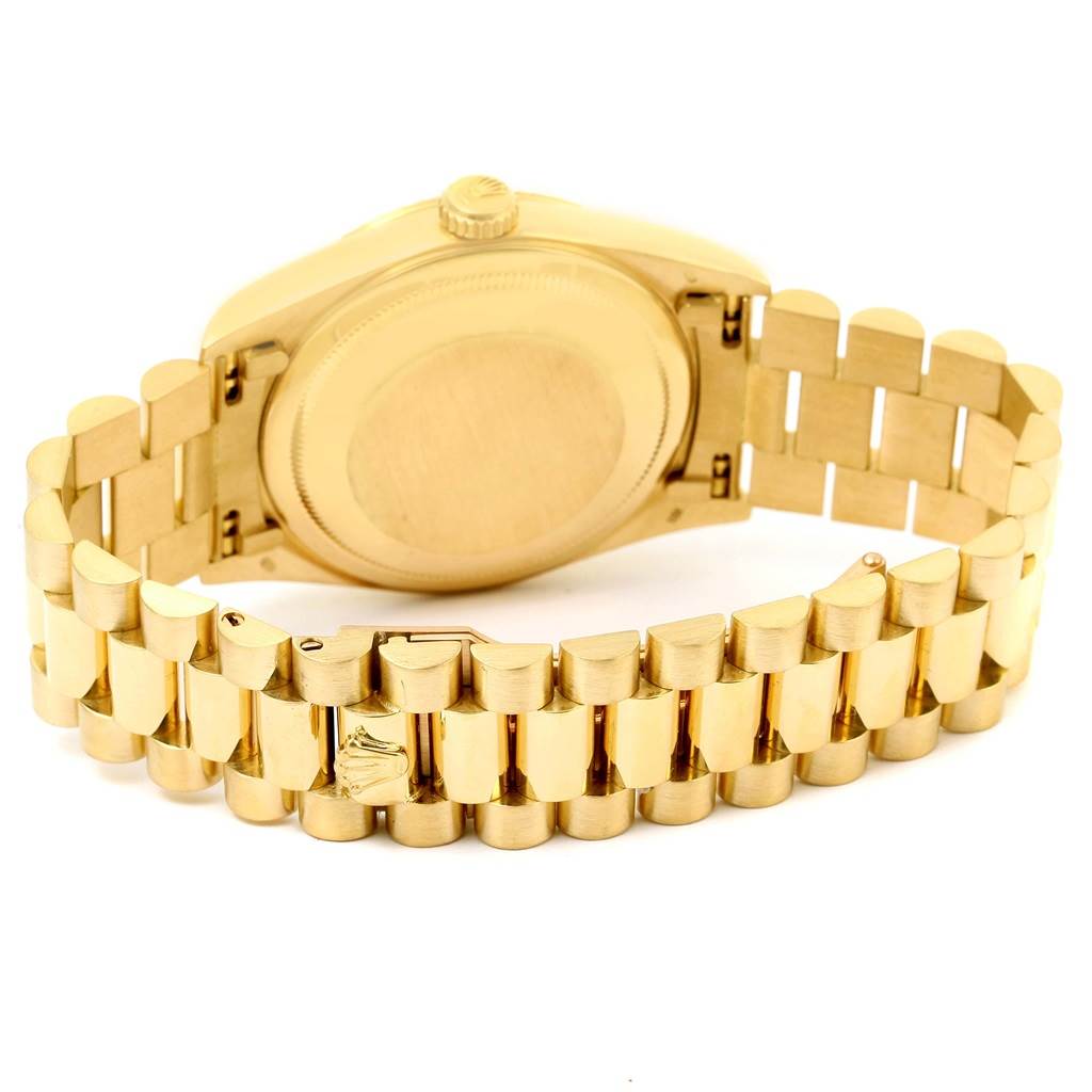 The image shows the back and bracelet of a gold Rolex President 18238 Men's Yellow Gold Blue Dial 18238 Men's Yellow Gold Blue Dial model watch from a tilted angle.