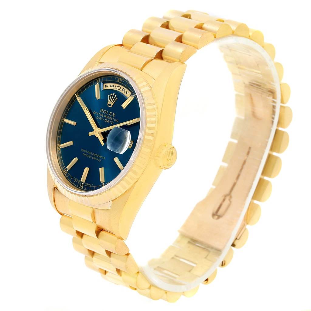 This image shows a gold Rolex President 18238 Men's Yellow Gold Blue Dial 18238 Men's Yellow Gold Blue Dial model watch at a three-quarter angle, highlighting the blue dial, bracelet, and crown.