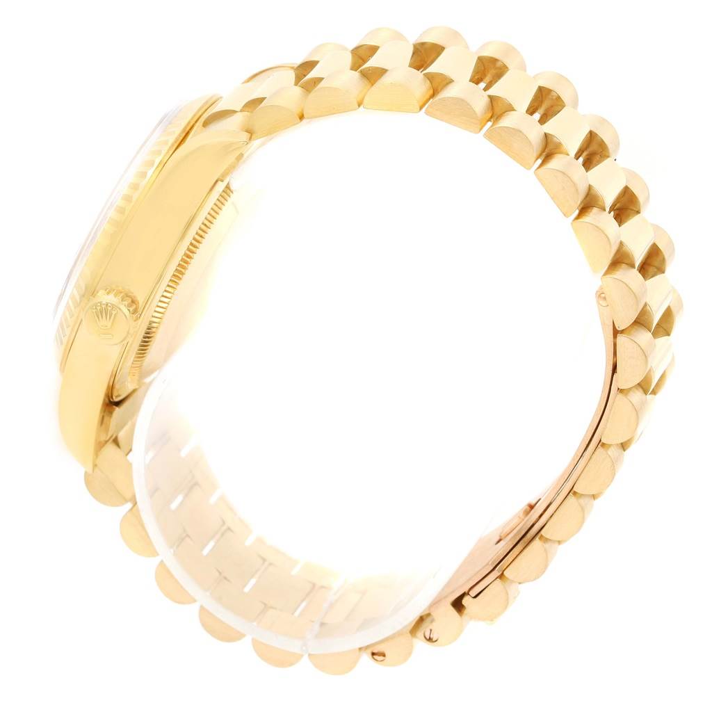 The Rolex President 18238 Men's Yellow Gold Blue Dial 18238 Men's Yellow Gold Blue Dial model is shown from the side, highlighting its case, crown, and gold bracelet.