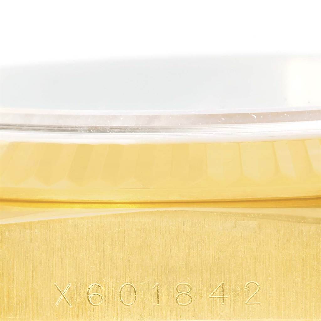 The image shows a close-up side view of the Rolex President 18238 Men's Yellow Gold Black Dial 18238 Men's Yellow Gold Black Dial model, highlighting the serial number engraved on the gold case.