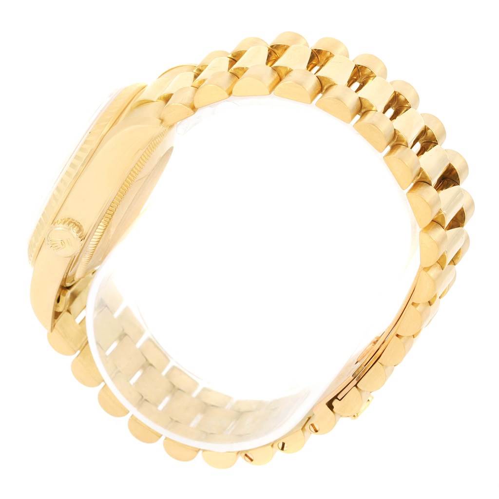 This image shows a side view of the gold bracelet and case of a Rolex President 18238 Men's Yellow Gold Black Dial 18238 Men's Yellow Gold Black Dial model.