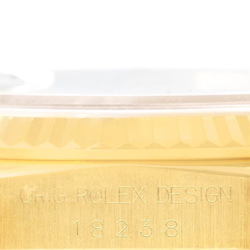 The image shows a close-up, side view of the case with the engraved model number and design of the Rolex President 18238 Men's Yellow Gold Black Dial 18238 Men's Yellow Gold Black Dial 18238 watch.