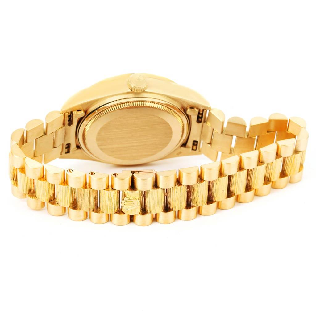 The image shows the backside and bracelet of a gold Rolex President 18078 Men
s Yellow Gold Silver Dial 18078 Men
s Yellow Gold Silver Dial model watch, focusing on the case and band links.