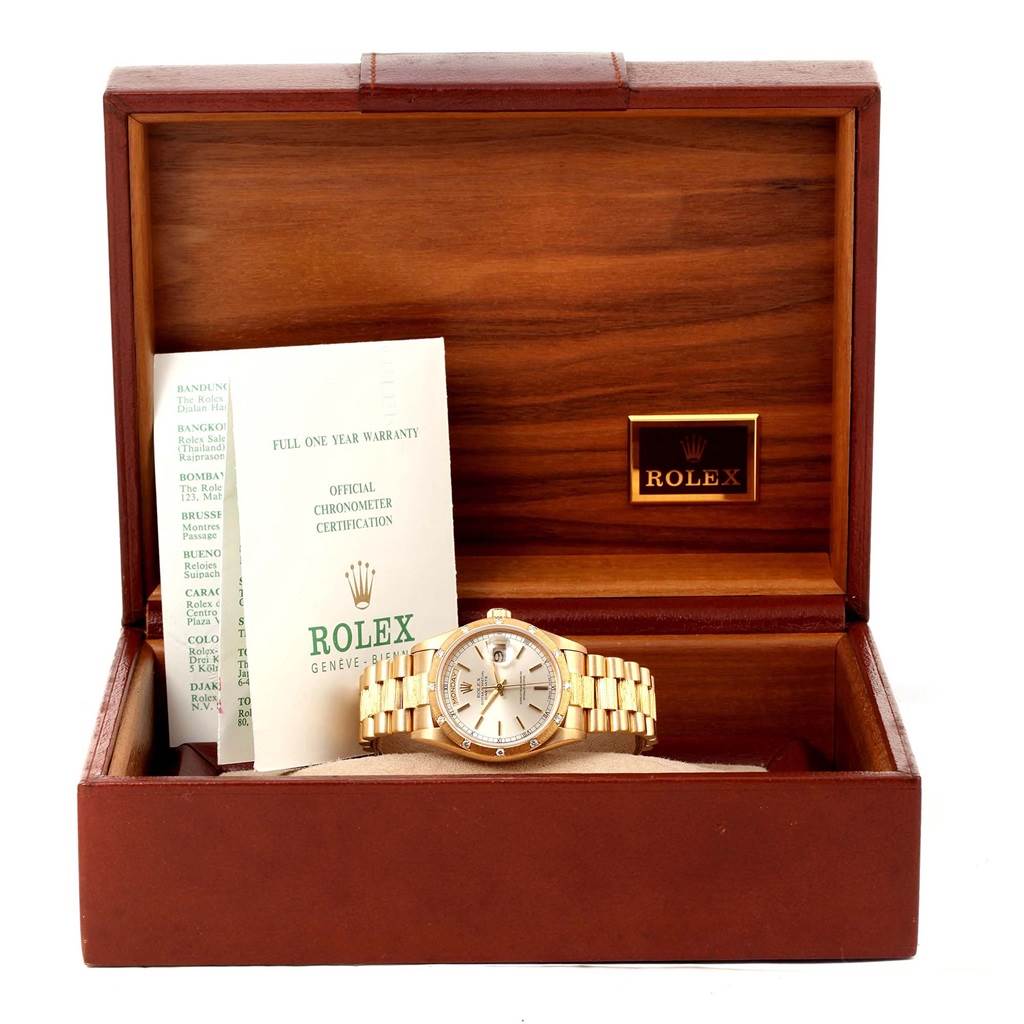 The Rolex President 18078 Men
s Yellow Gold Silver Dial 18078 Men
s Yellow Gold Silver Dial model watch is shown in its box, accompanied by documentation and certification.